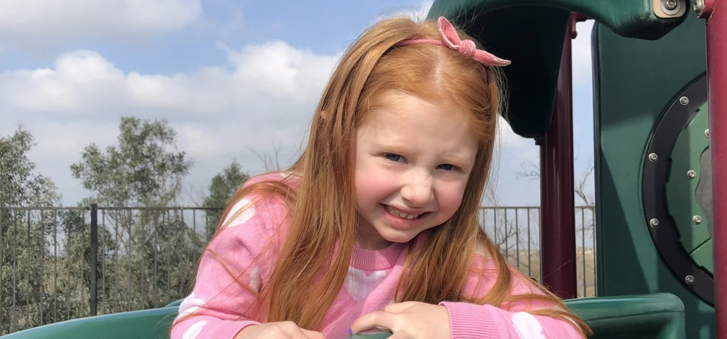 student on a playground slide